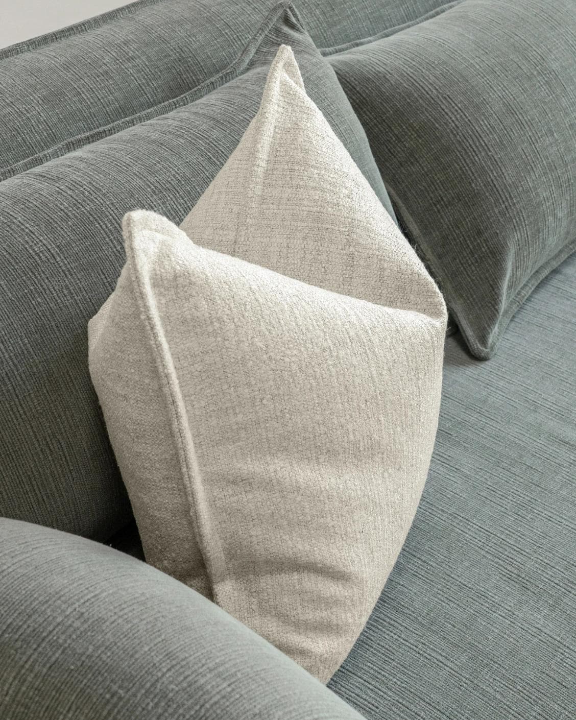 Emmett Bianca cushion in off white, shown in a lifestyle top view as image 5