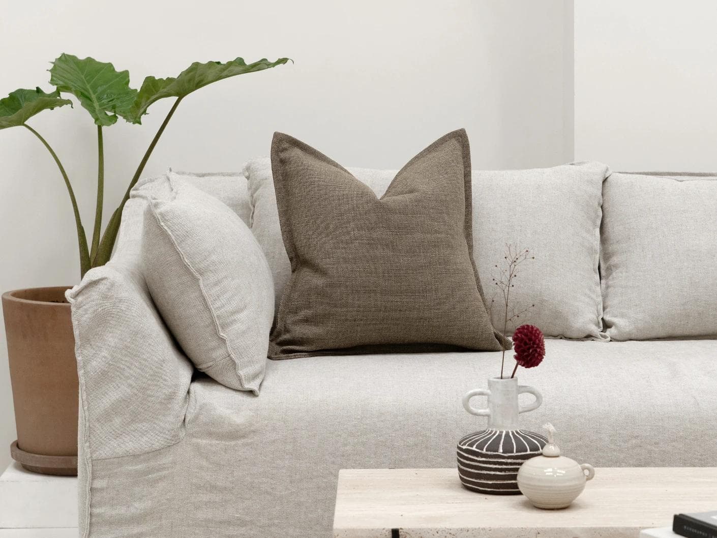 Emmett Braun cushion in brown, shown in a lifestyle front view as image 4
