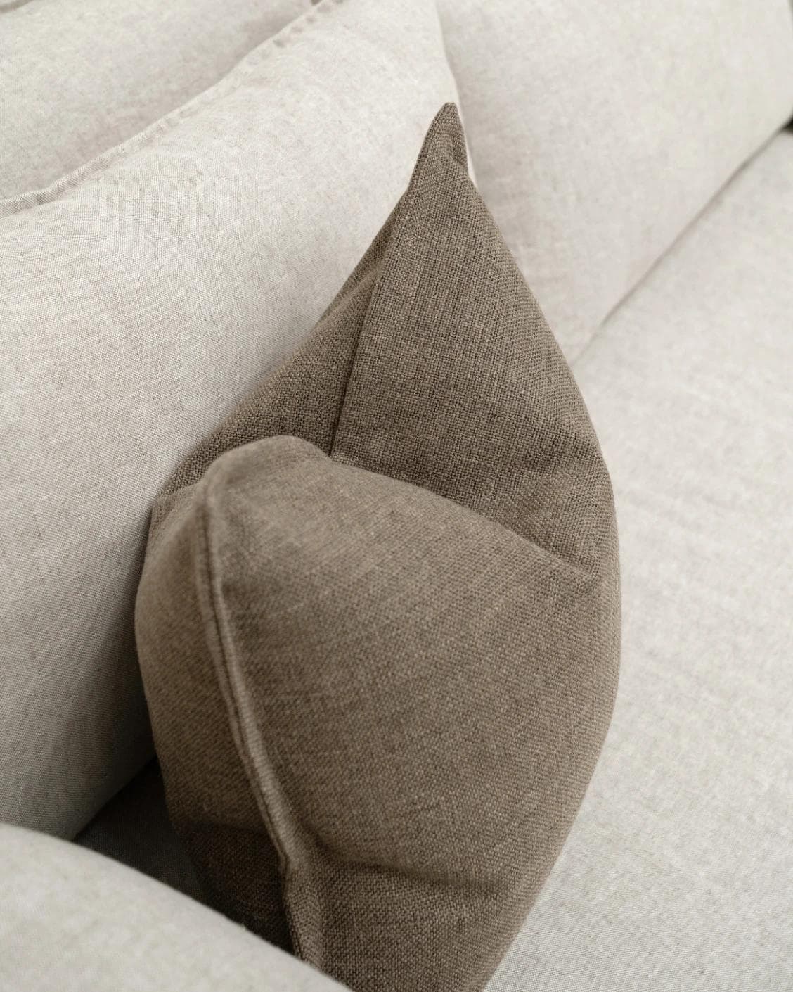Emmett Braun cushion in brown, shown in a lifestyle top view as image 5
