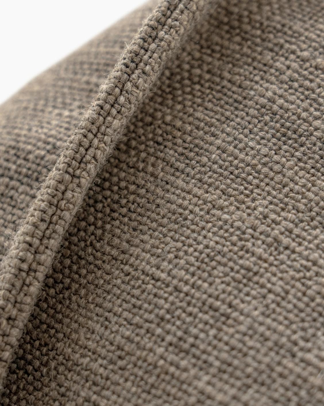 Emmett Braun cushion in brown, shown in a product close-up as image 8
