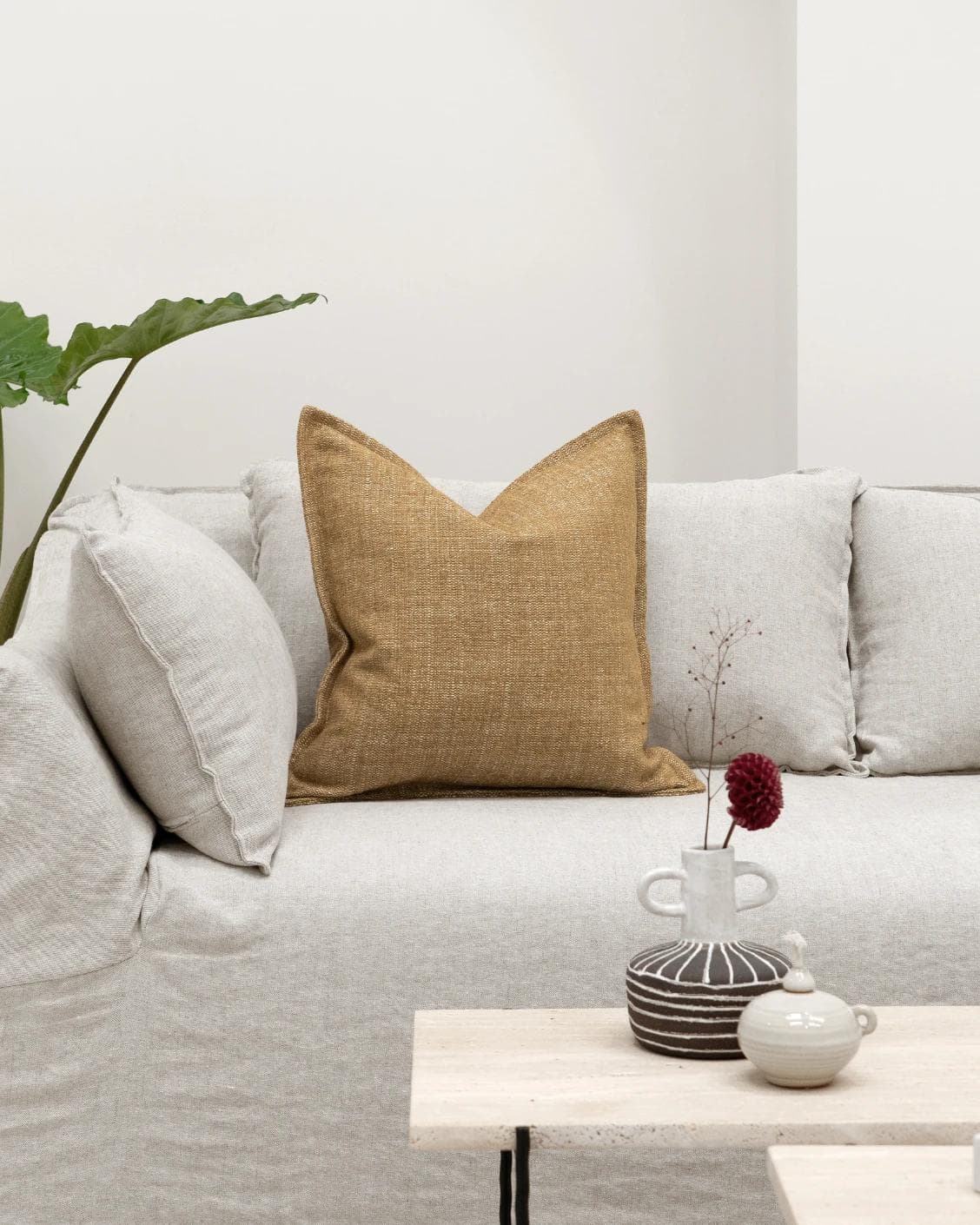 Emmett Dijon cushion in beige, shown in a lifestyle front view as image 4