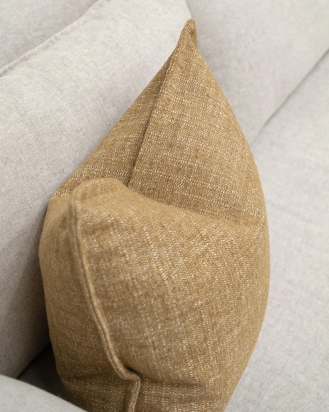 Emmett Dijon cushion in beige, shown in a lifestyle top view as image 5