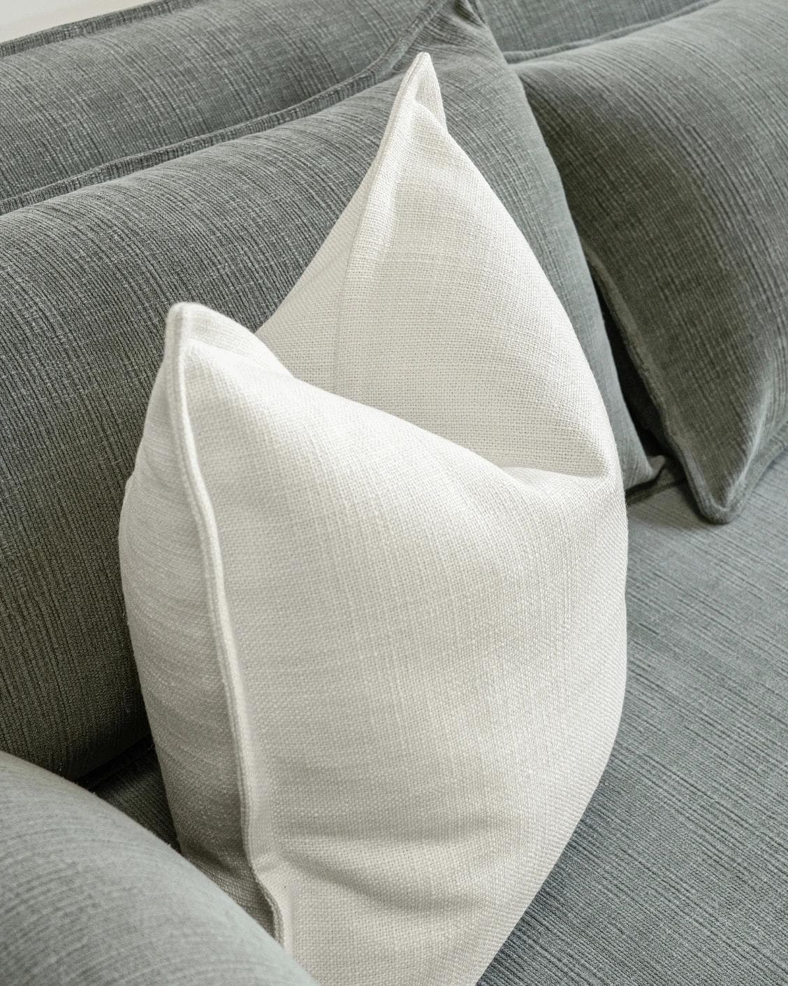 Emmett Jasmine cushion in white, shown in a lifestyle top view as image 5