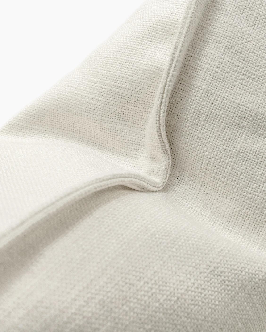 Emmett Jasmine cushion in white, shown in a product close-up as image 7
