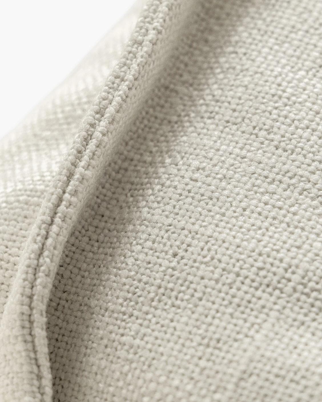 Emmett Jasmine cushion in white, shown in a product close-up as image 8