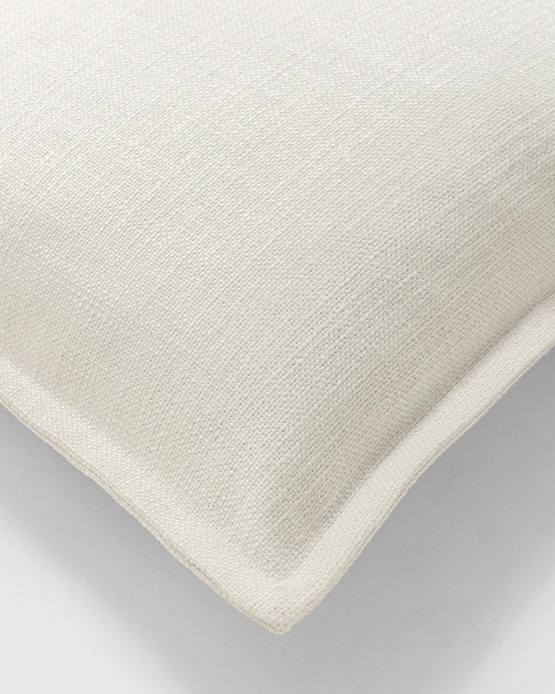 Emmett Jasmine cushion in white, shown in a product top view as image 9