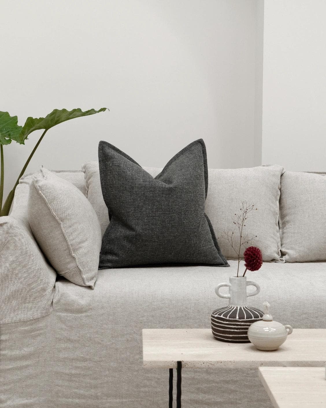 Emmett Nyx cushion in grey, shown in a lifestyle front view as image 4