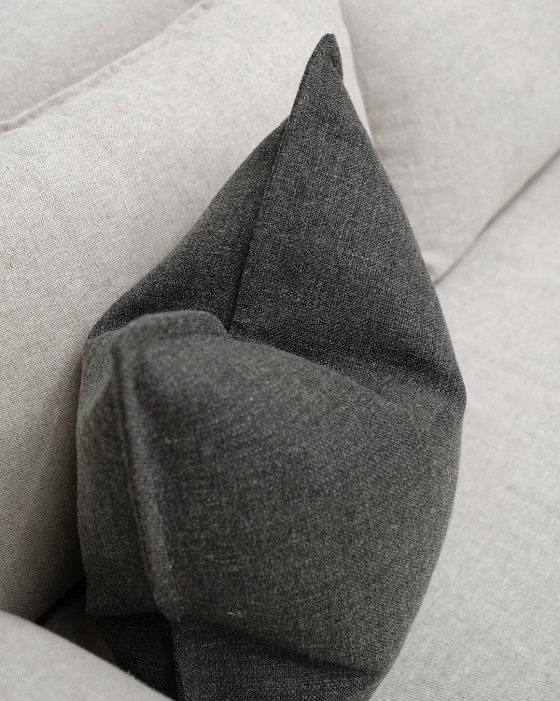 Emmett Nyx cushion in grey, shown in a lifestyle top view as image 5