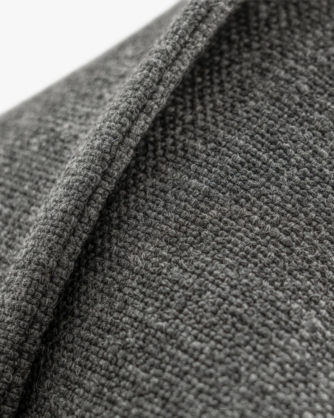 Emmett Nyx cushion in grey, shown in a product close-up as image 8