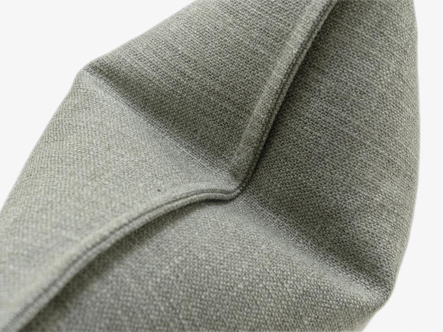 Emmett Olive cushion in green, shown in a product close-up as image 6