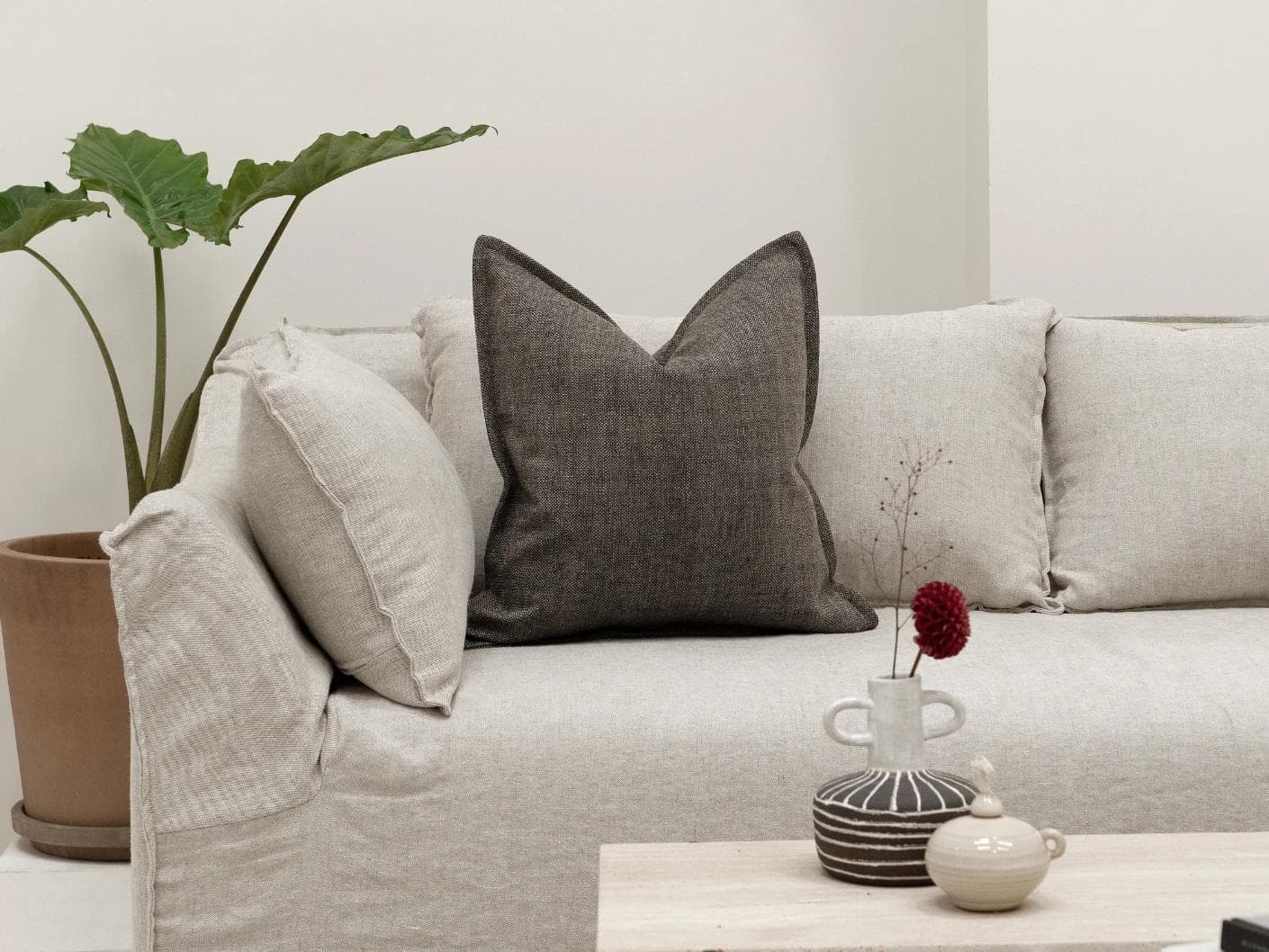 Emmett Pepper cushion in charcoal, shown in a lifestyle front view as image 3