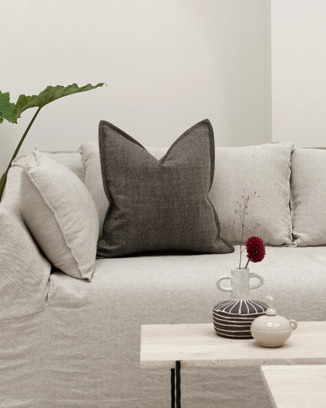 Emmett Pepper cushion in charcoal, shown in a lifestyle front view as image 3