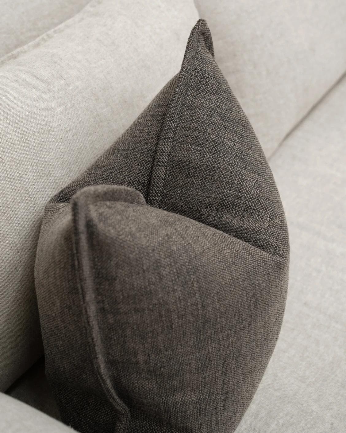 Emmett Pepper cushion in charcoal, shown in a lifestyle top view as image 5