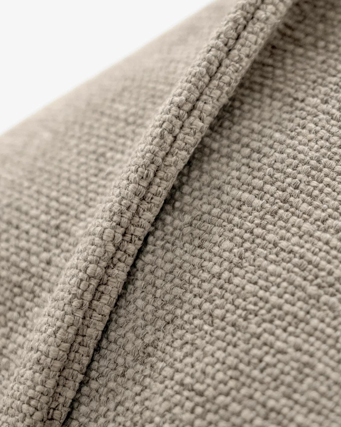 Emmett Quell cushion in taupe and grey, shown in a product close-up as image 8