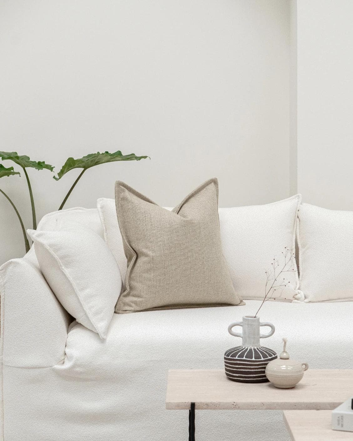 Emmett Shale cushion in beige, shown in a lifestyle front view as image 3