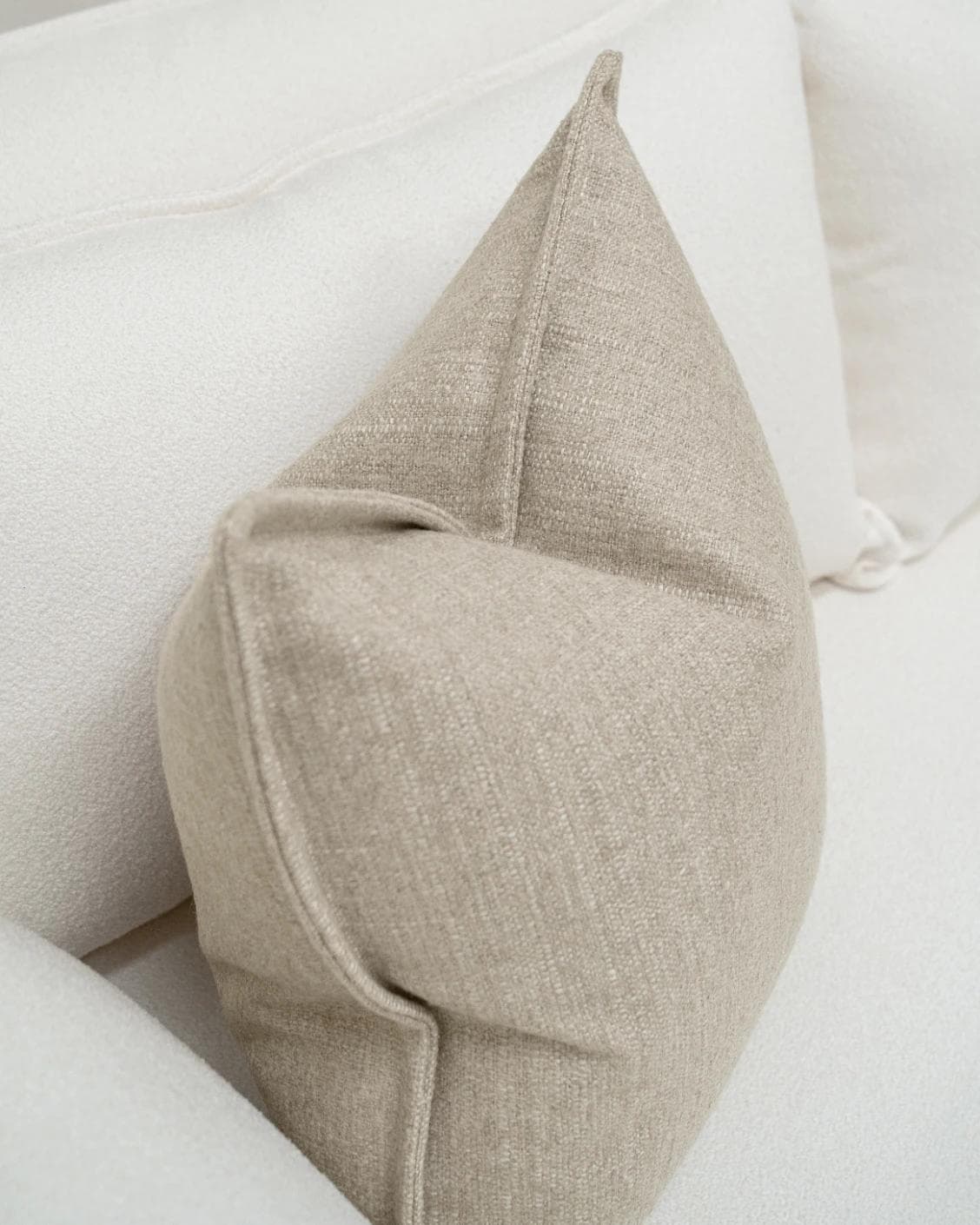 Emmett Shale cushion in beige, shown in a lifestyle top view as image 5