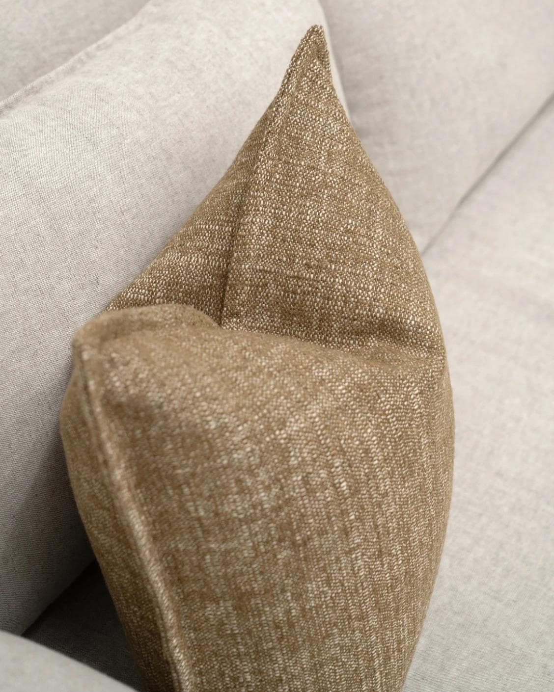 Emmett Tawna cushion in brown, shown in a lifestyle top view as image 5