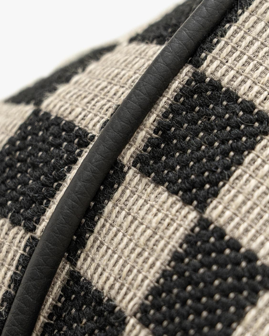 Enya Steele cushion in black and beige, shown in a product close-up as image 2