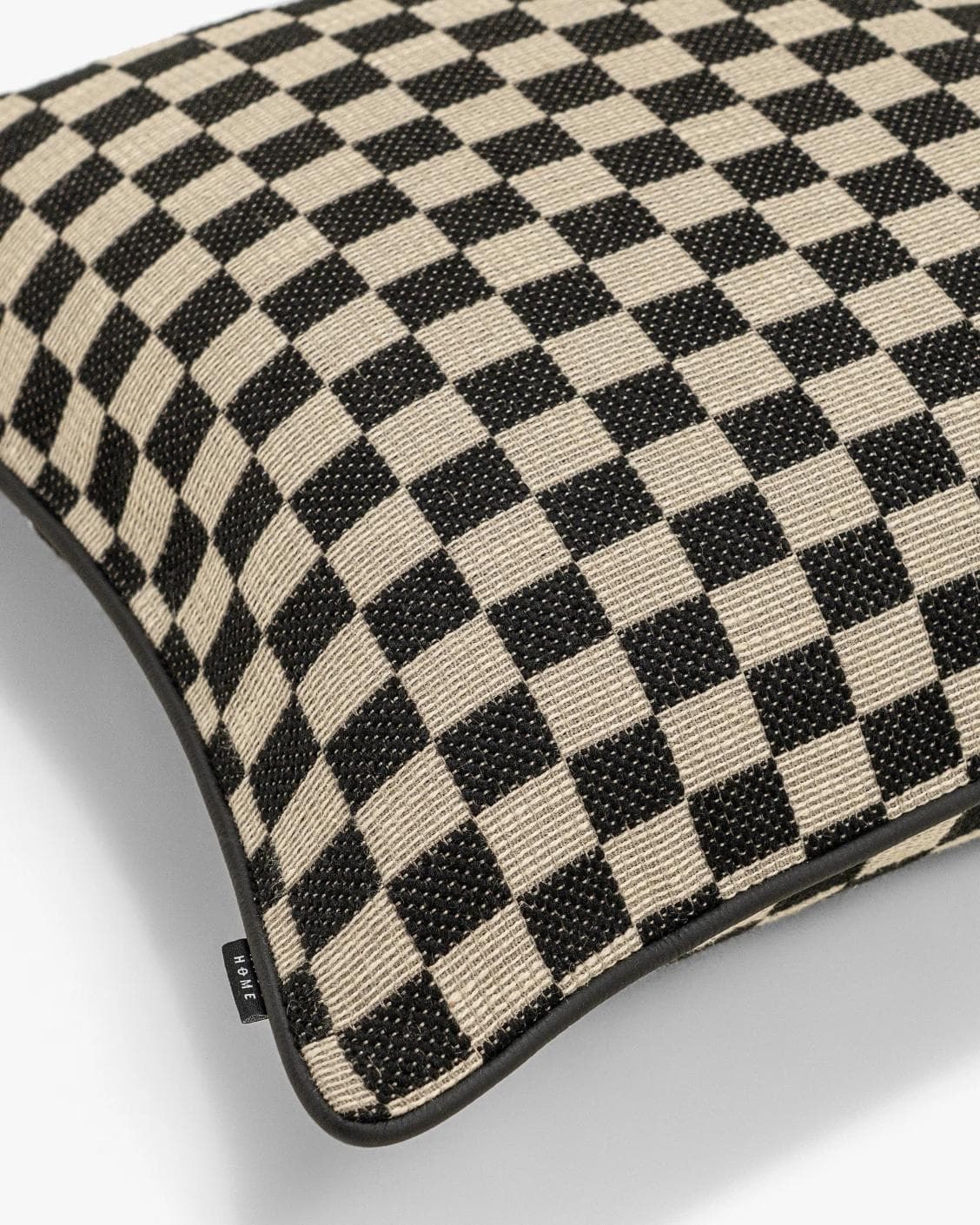 Enya Steele cushion in black and beige, shown in a product top view as image 10