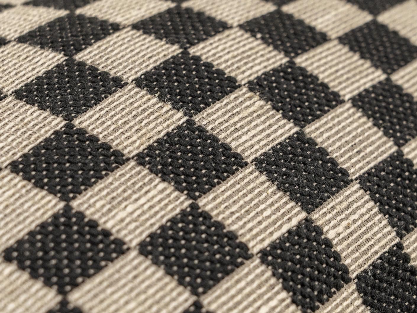 Enya Steele II cushion in black and beige, shown in a product close-up as image 4