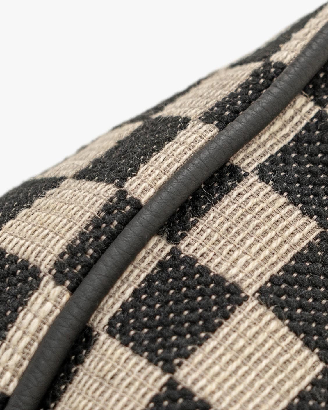 Enya Steele II cushion in black and beige, shown in a product close-up as image 6