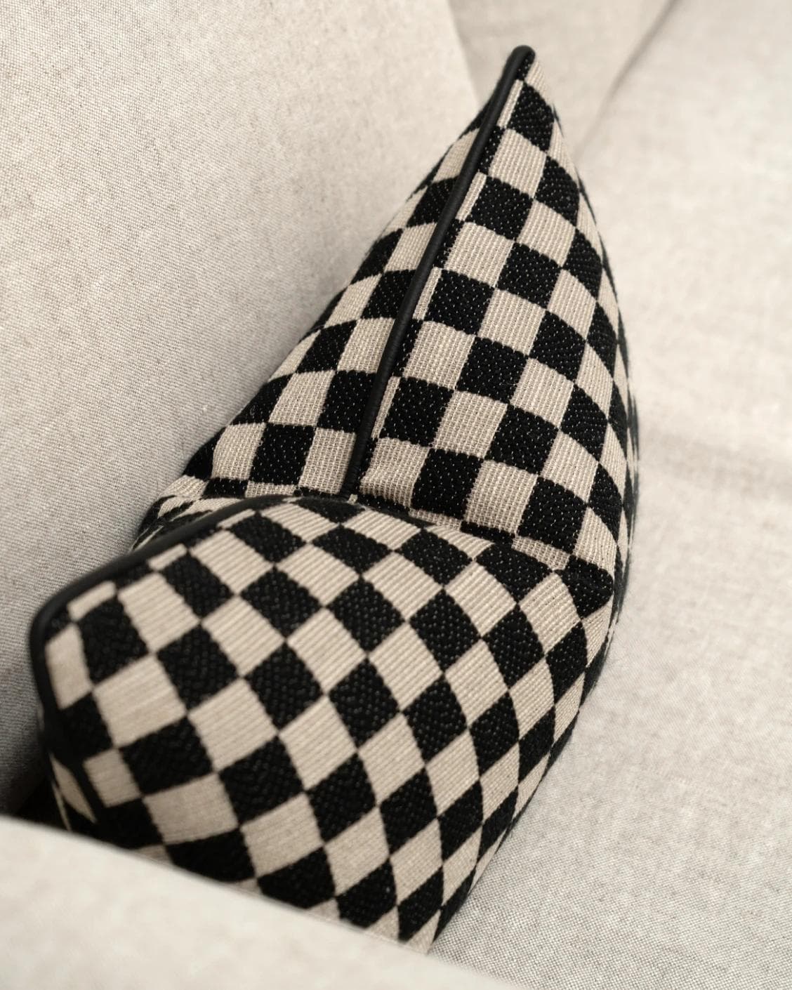 Enya Steele II cushion in black and beige, shown in a product top view as image 9