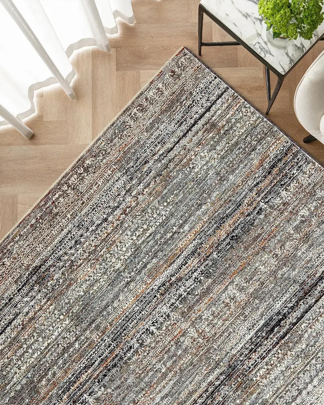 Ethan Ebony carpet in grey, shown in a lifestyle top view as image 2