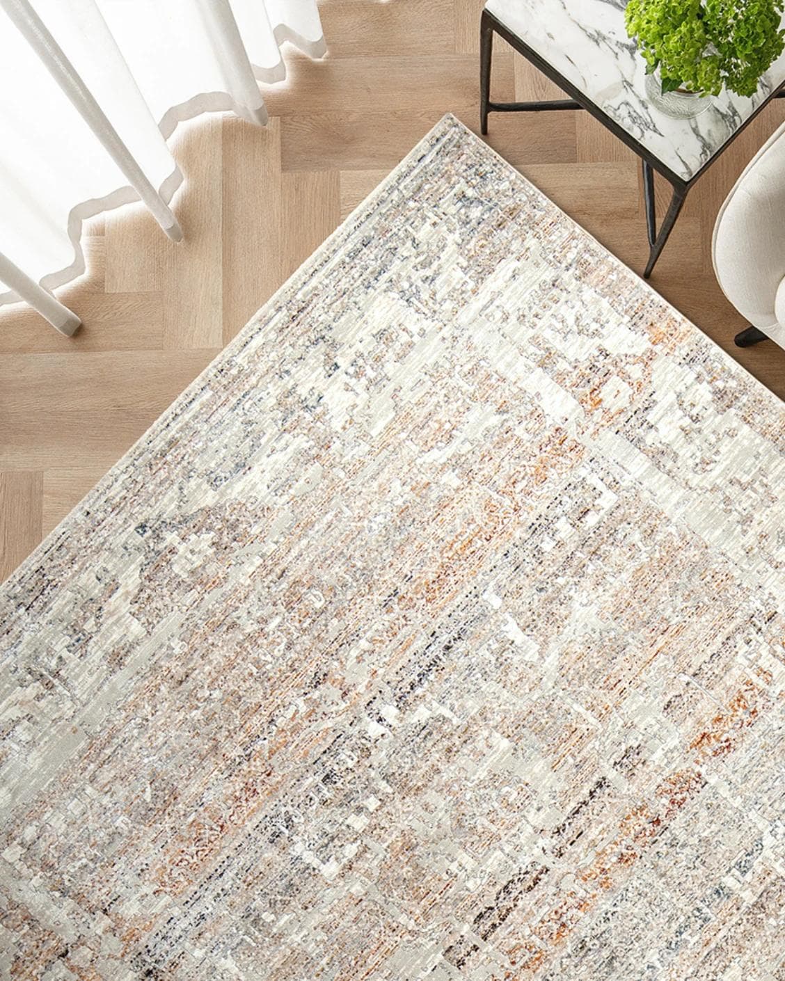 Ethan Martin carpet in beige and grey, shown in a lifestyle top view as image 2