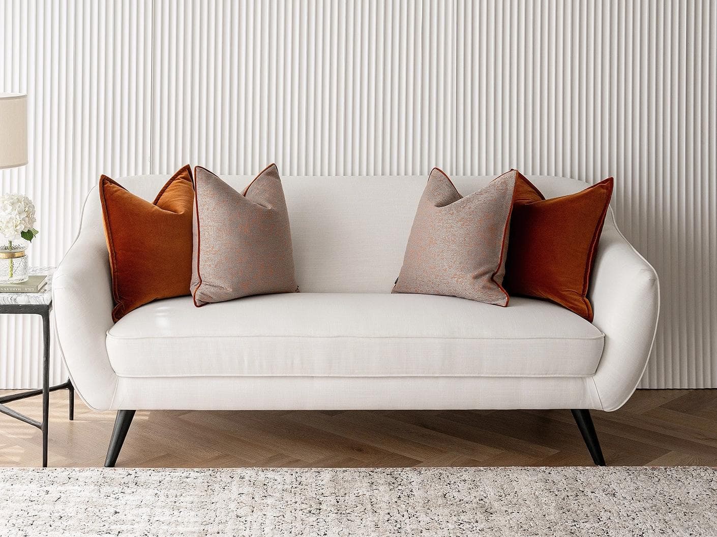 Evander Bundle cushion in rust, shown in a lifestyle front view as image 4