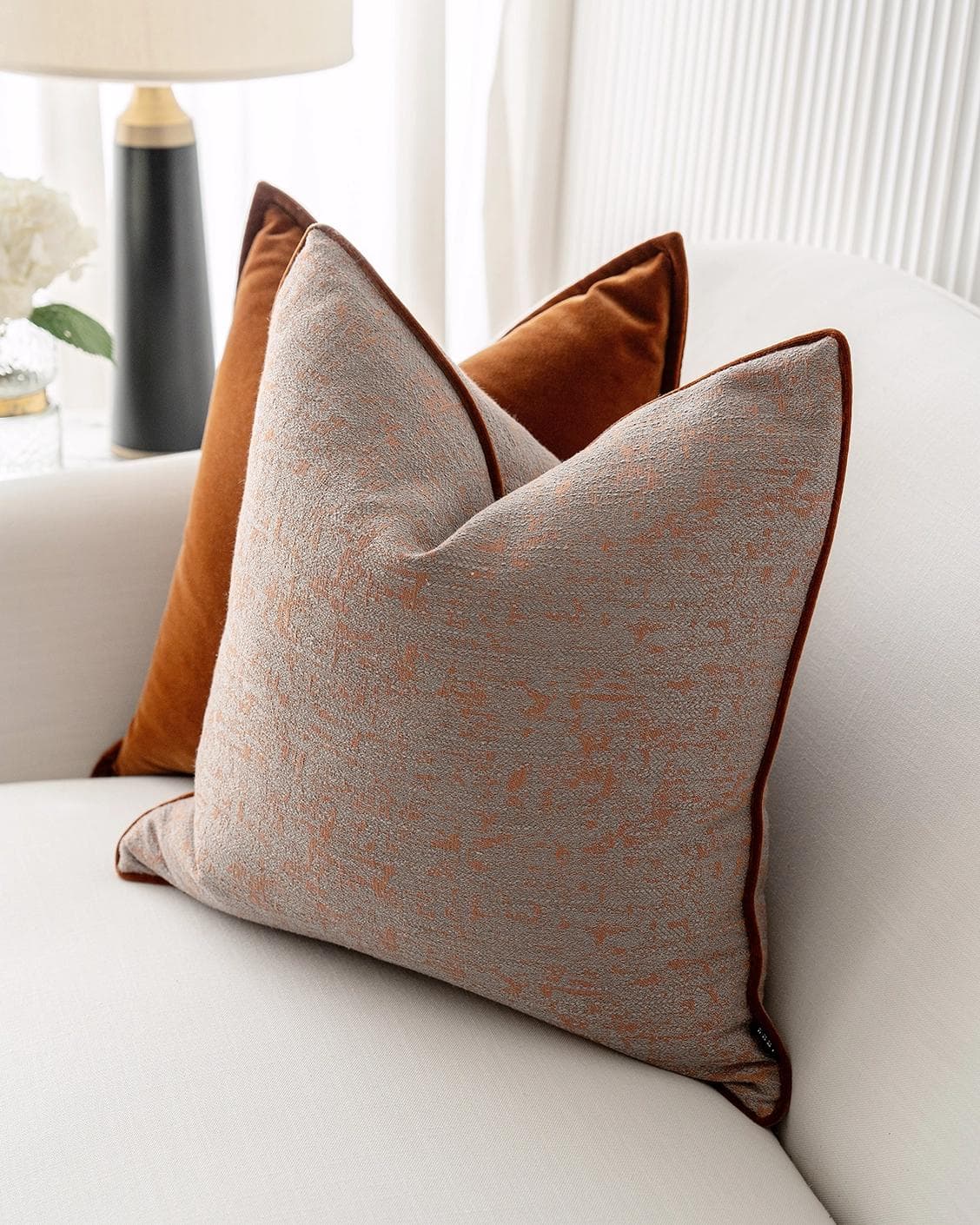 Evander Bundle cushion in rust, shown in a lifestyle right view as image 6