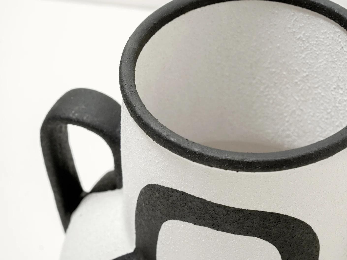Evelina Arneson vases in black and white, shown in a product close-up top view as image 11