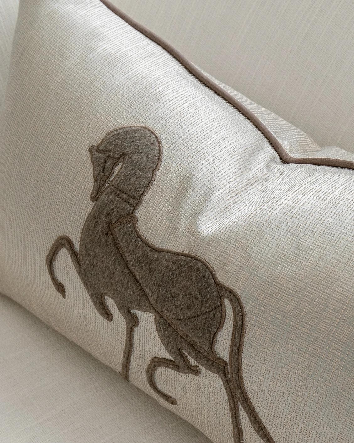 Faaris Laurent cushion in brown and beige, shown in a lifestyle top view as image 5