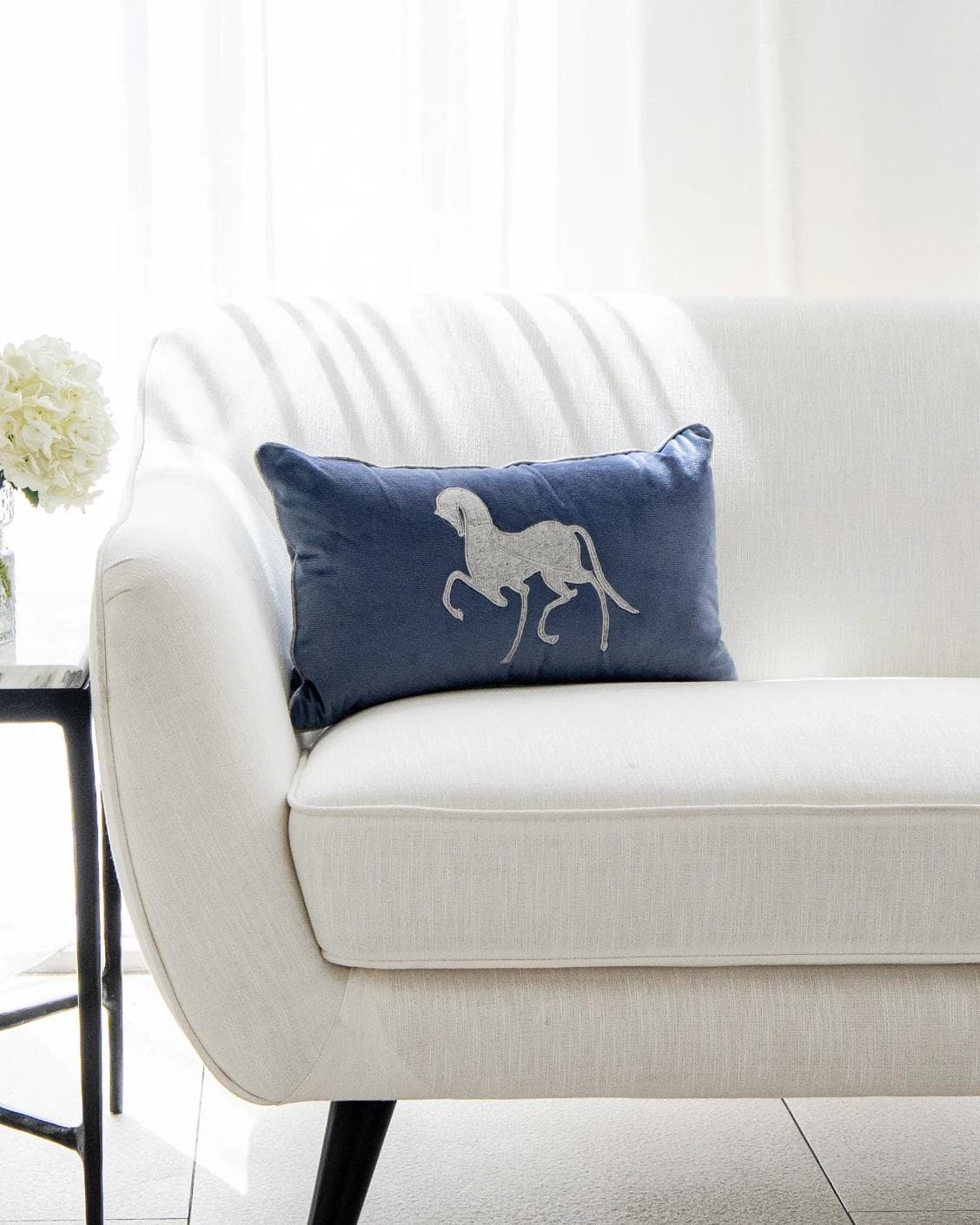 Faaris Matisse cushion in blue and silver, shown in a lifestyle front view as image 4