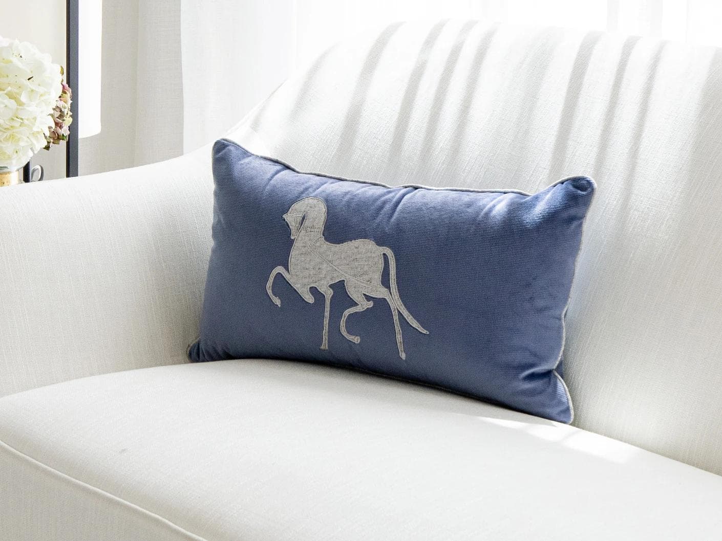 Faaris Matisse cushion in blue and silver, shown in a lifestyle right view as image 2