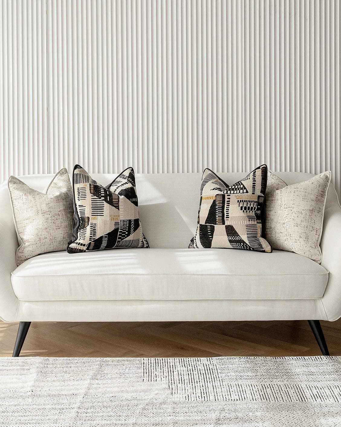 Fabron Bundle cushion, shown in a lifestyle front view as image 4