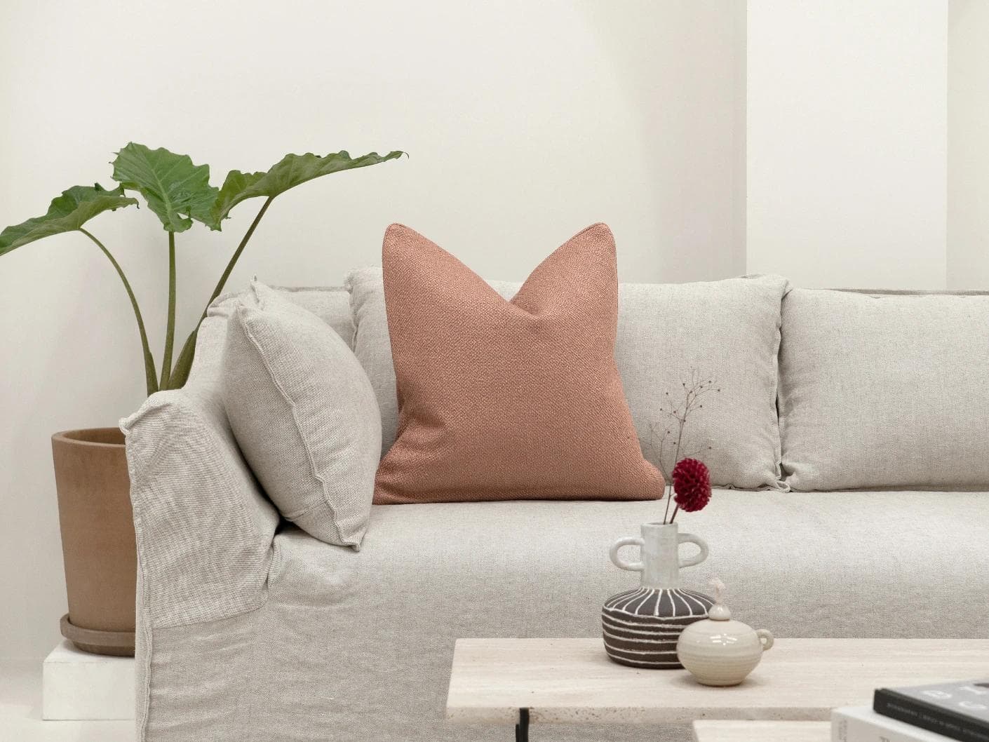 Fae Blush cushion in pink, shown in a lifestyle front view as image 4