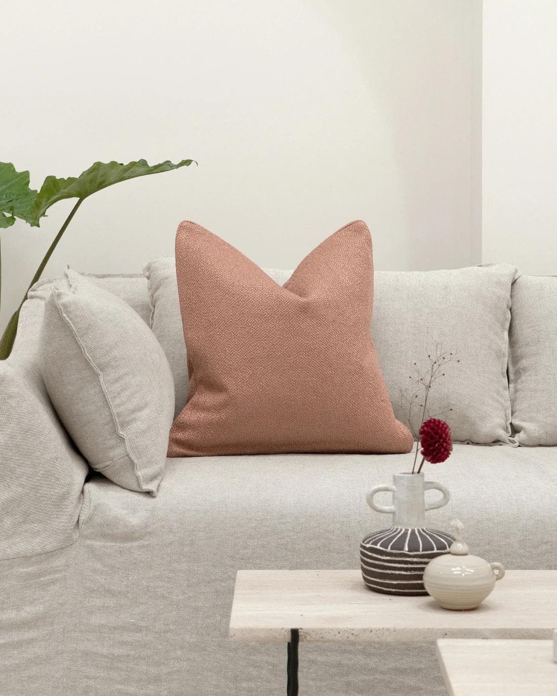 Fae Blush cushion in pink, shown in a lifestyle front view as image 4