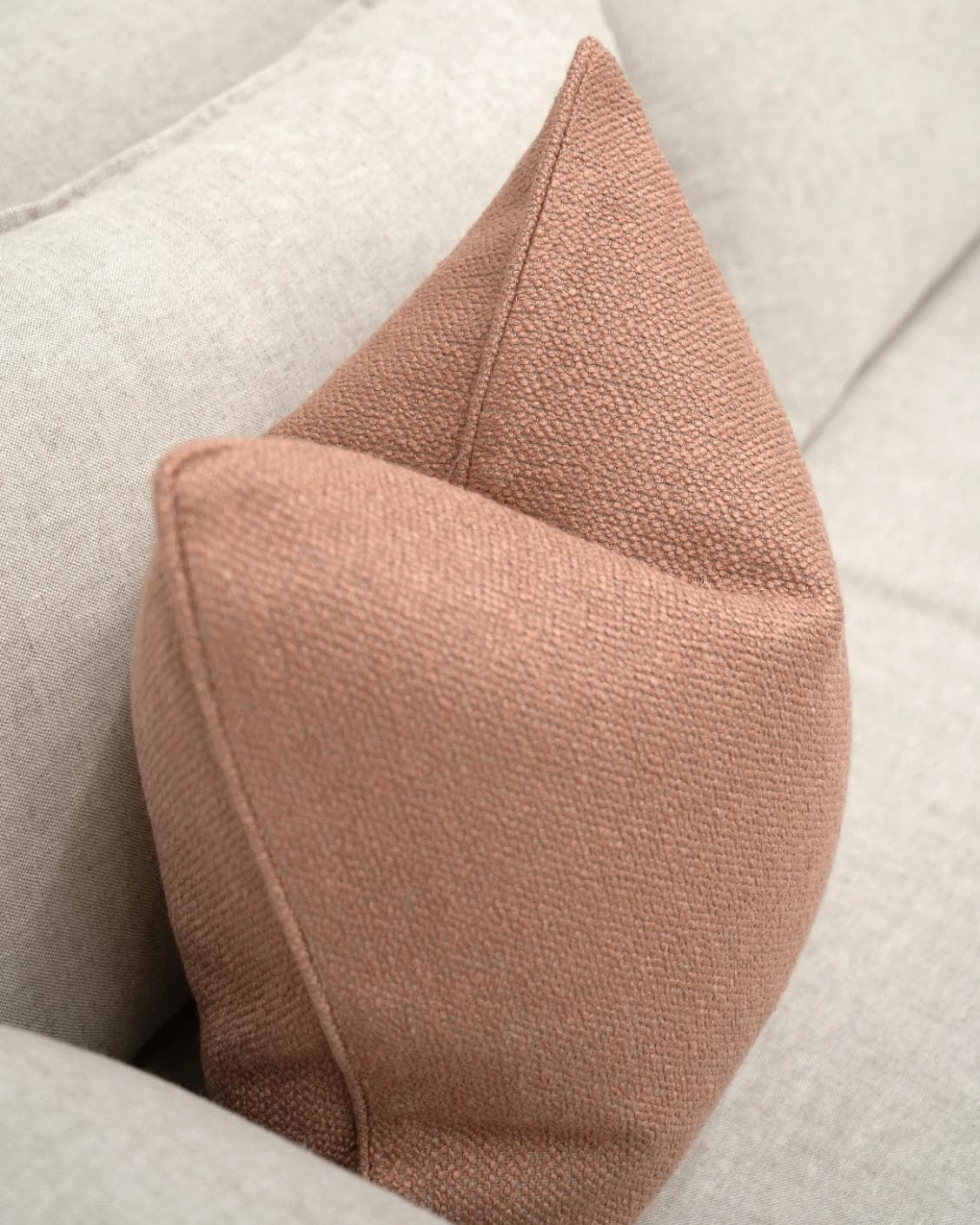 Fae Blush cushion in pink, shown in a lifestyle top view as image 5