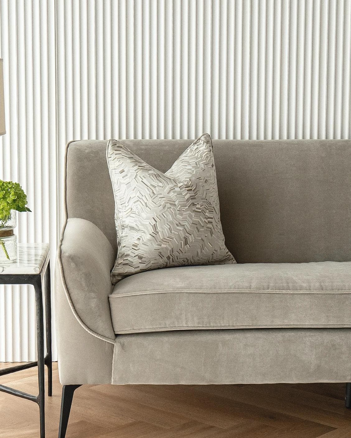 Faye Hodler cushion in silver and grey, shown in a lifestyle front view as image 4