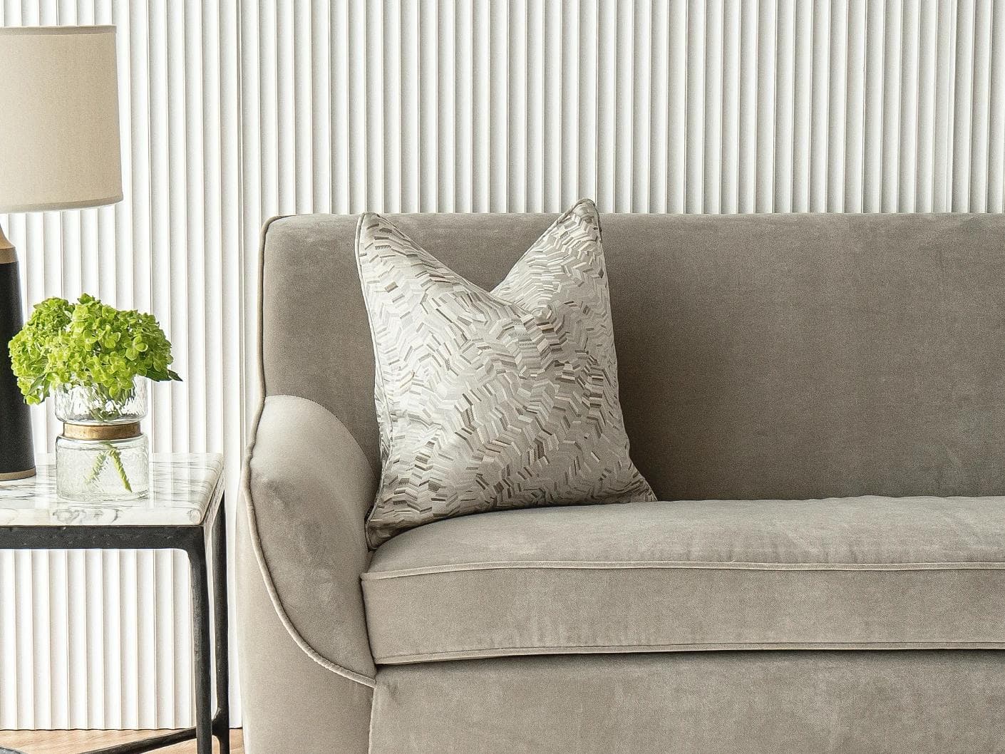 Faye Hodler cushion in silver and grey, shown in a lifestyle front view as image 4