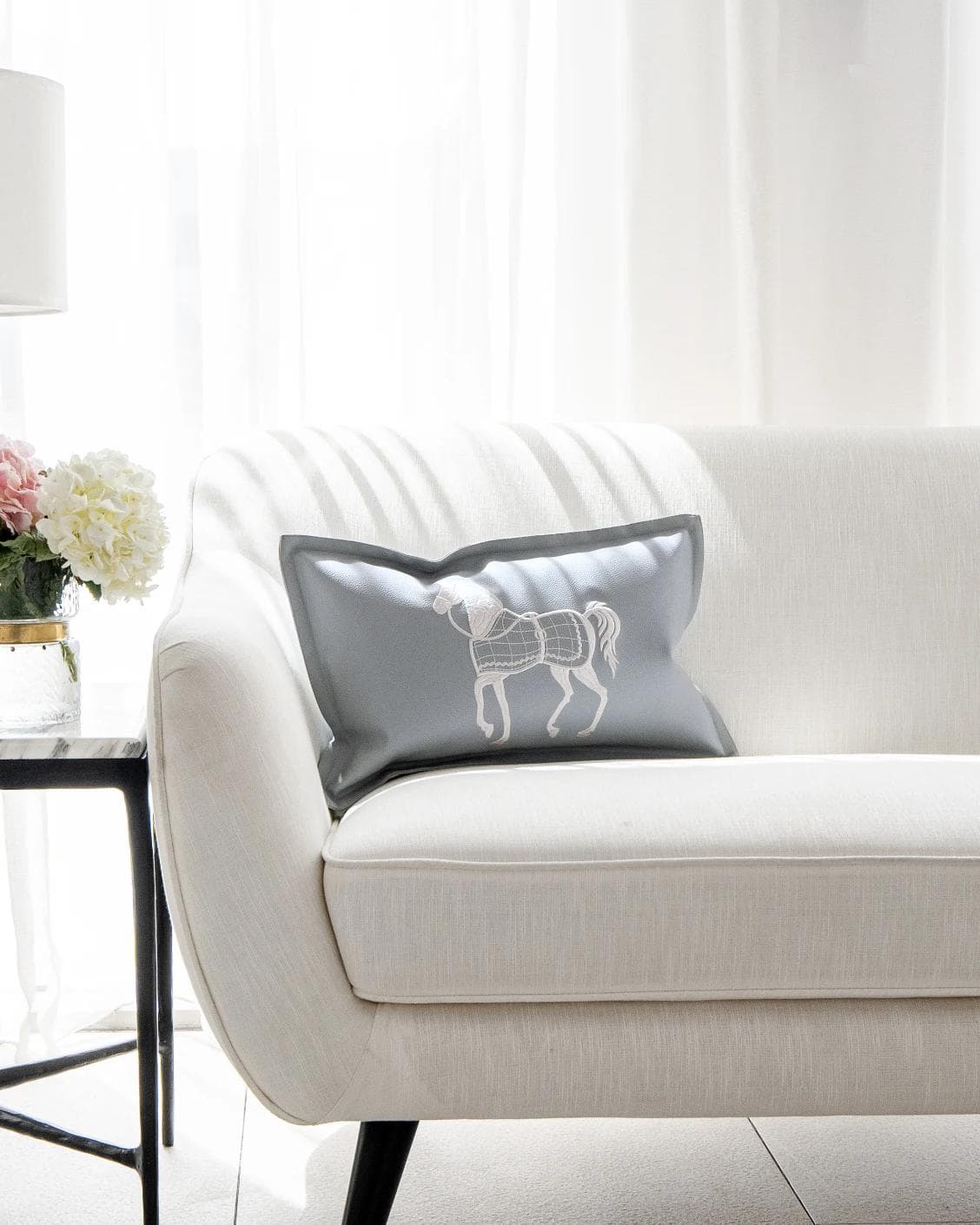 Filip Matisse cushion in blue and white, shown in a lifestyle front view as image 4