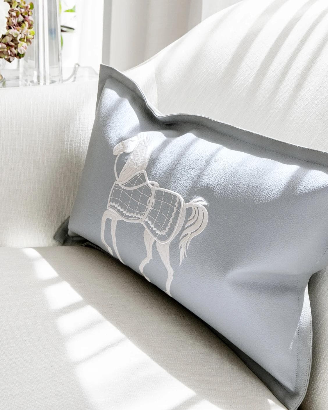 Filip Matisse cushion in blue and white, shown in a lifestyle right view as image 5