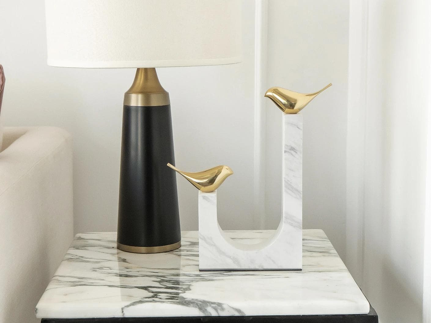 Finch Butterfield statues and sculptures in white and gold, shown in a lifestyle front view as image 1