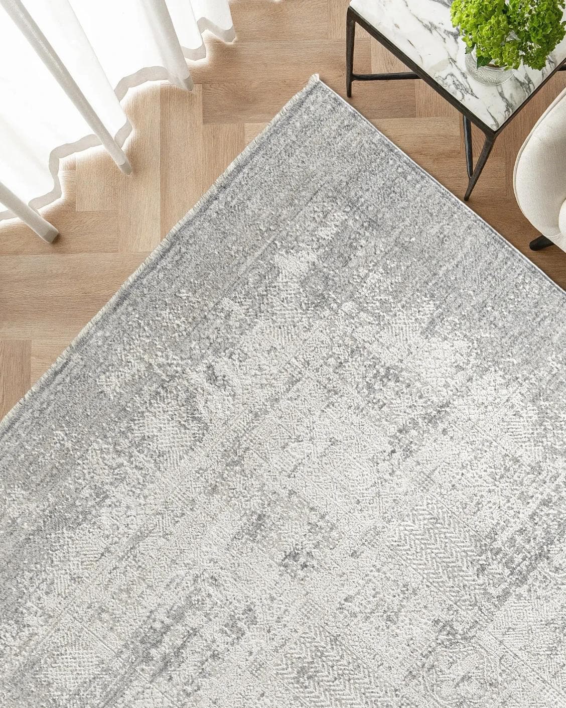 Finley Dune carpet in grey, shown in a lifestyle top view as image 2