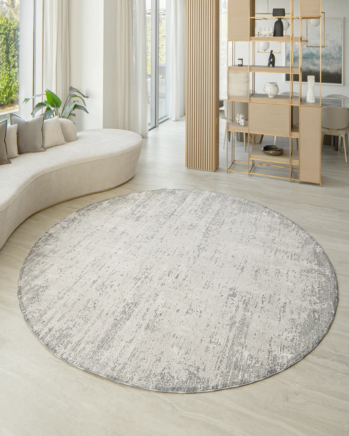 Finley Dune Round carpet in grey, shown in a lifestyle front view