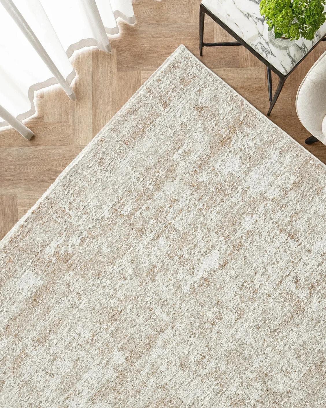Finley Rust carpet in beige, shown in a lifestyle top view as image 2