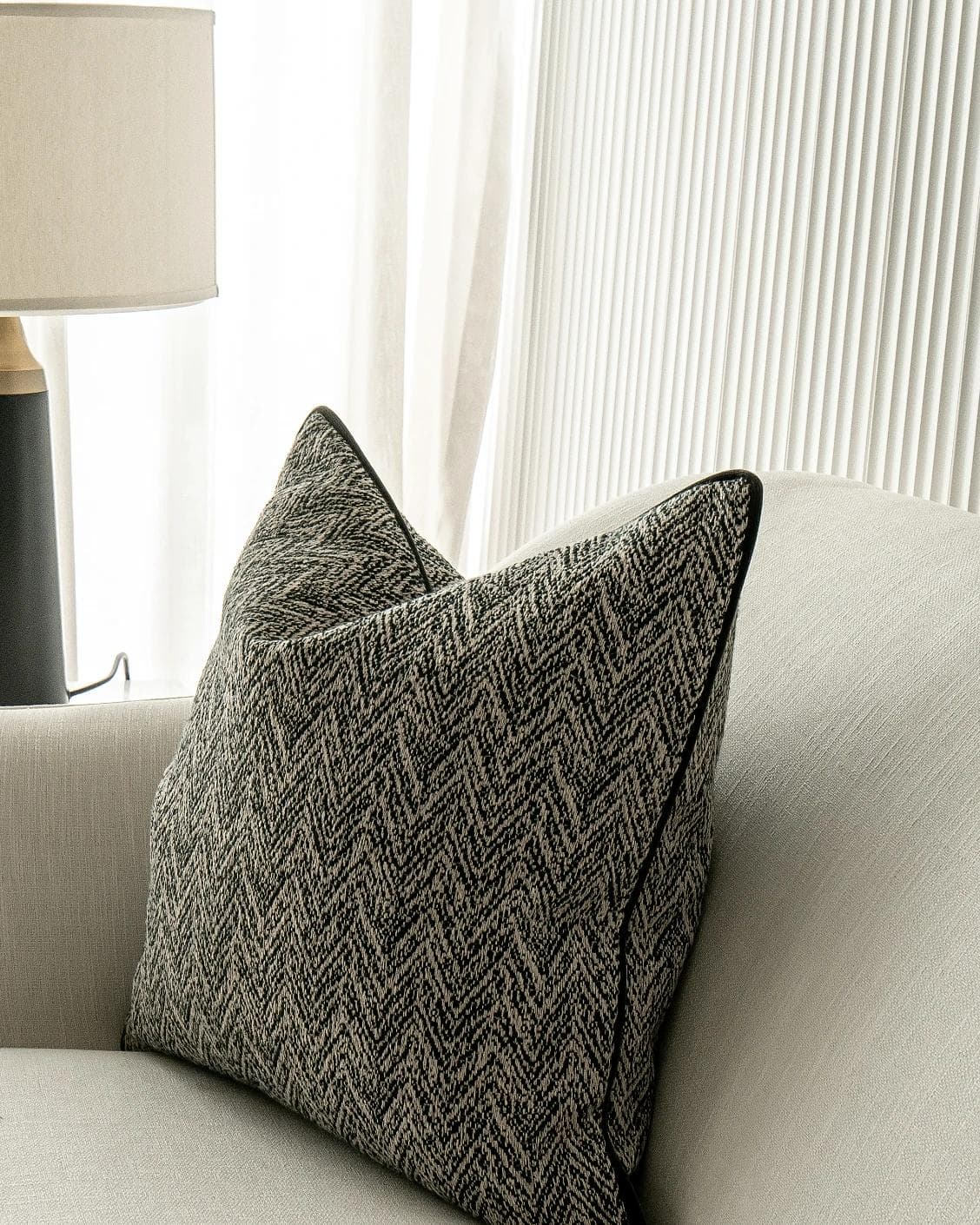 Fleur Steele cushion in black and white, shown in a lifestyle right view as image 5