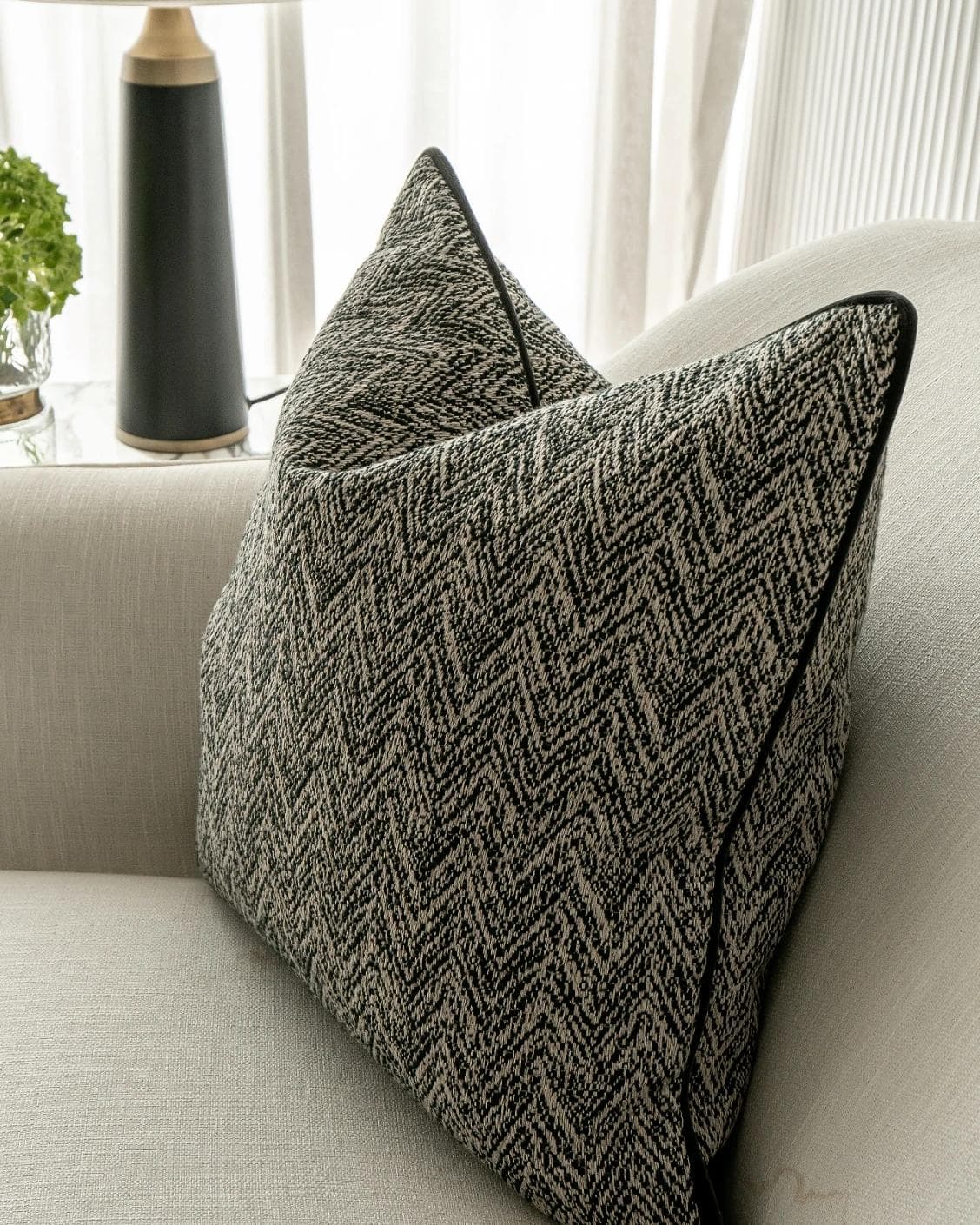 Fleur Steele cushion in black and white, shown in a lifestyle right view as image 6