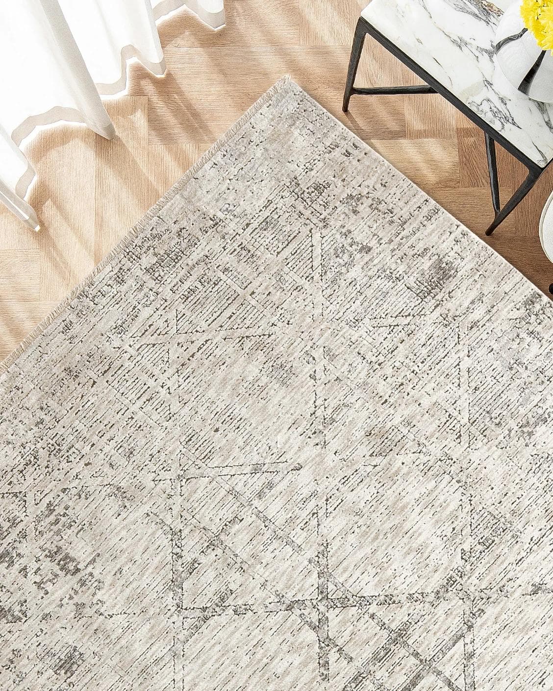 Freida Ashton carpet in grey and beige, shown in a lifestyle top view as image 2