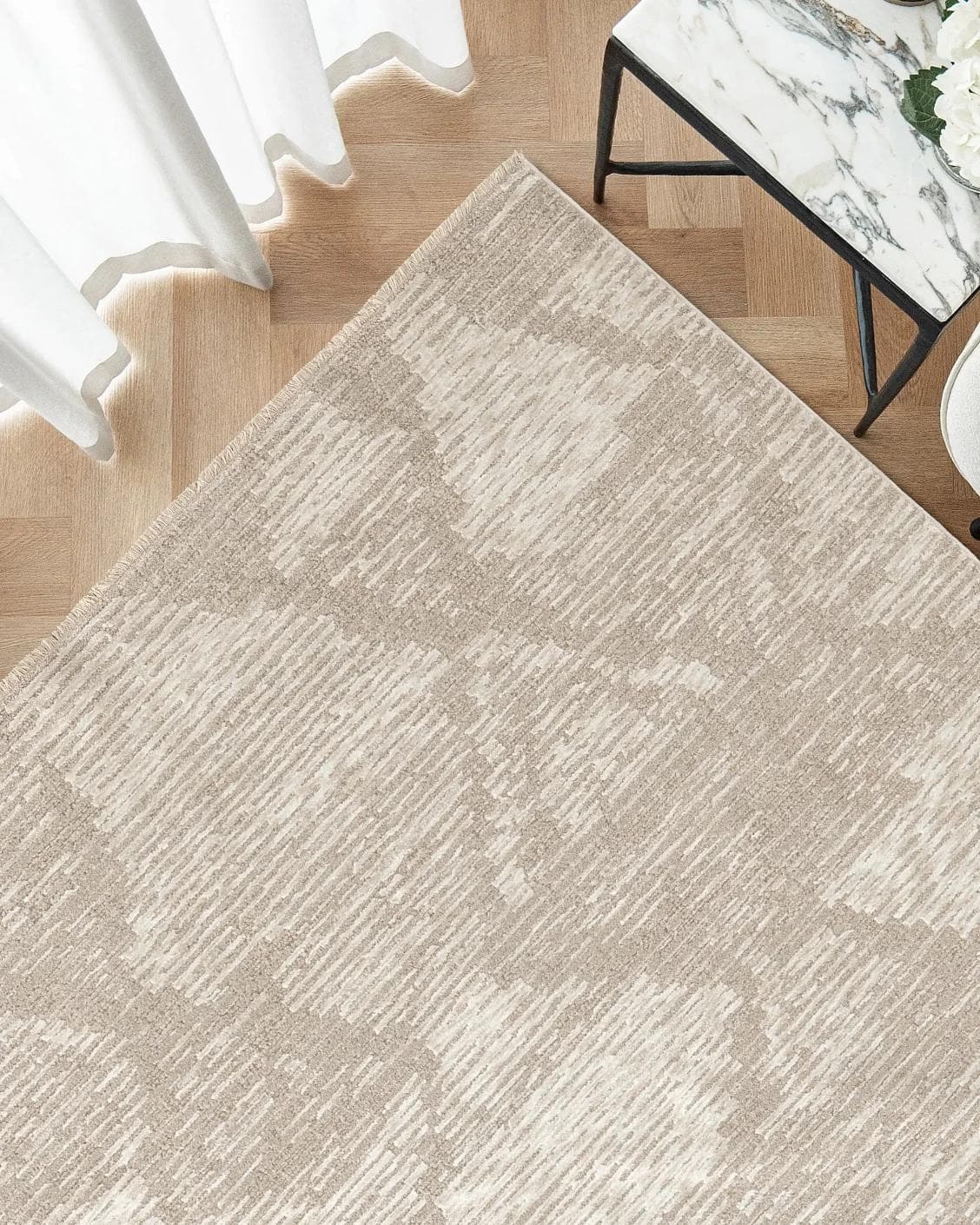 Freida Sandy carpet in beige, shown in a lifestyle top view as image 2